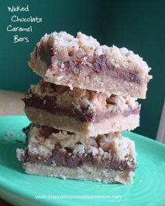 Wicked Chocolate Caramel Bars-An Oatmeal cookie Crust, gooey chocolate and caramel in the center then topped with more cookie crumbs!