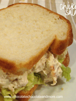 Chicken Salad Sandwich on a white plate with lettuce visible