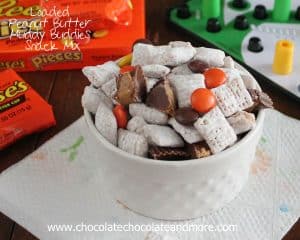 Loaded Peanut Butter Muddy Buddies Snack Mix-with Reeses Pieces and Reeses Peanut Butter Cups your family will eat it up!