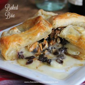 Baked Brie topped with rum soaked raisins, pecans and just a touch of maple syrup. then wrapped in a flaky puff pastry.