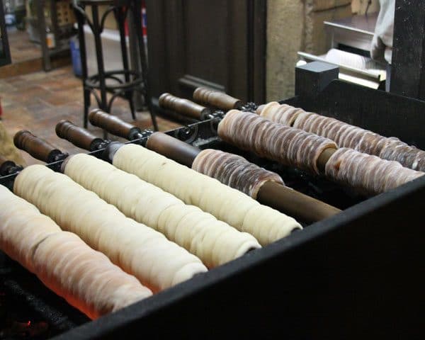 Trdelnik (a Czech pastry covered in cinnamon sugar) cooked over coals in Prague