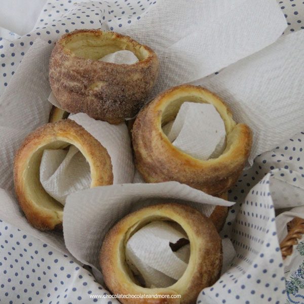This Czech Cinnamon Pastry-Trdelnik is sold by street vendors all over Prague, A yeast dough, wrapped around a cylinder, rolled in cinnamon sugar and then baked over an open flame.