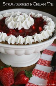 Strawberries and Cream Pie-a surprise cream cheese layer adds to it's creamy decadence. Topped with fresh strawberries and a homemade glaze.
