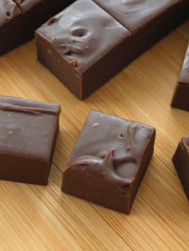 slices of delectable chocolate fudge sitting on a cutting board