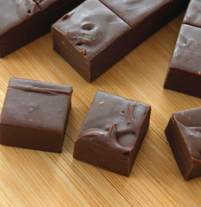 slices of delectable chocolate fudge sitting on a cutting board