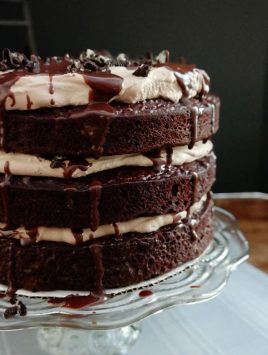 Mississippi Mudslide Cake-from the Grandbaby Cakes cookbook, 3 layers of rich cake sandwich a Kahlua infused chocolate whipped cream, crushed cookies and chocolate ganache, this is a chocolate lovers dream cake!