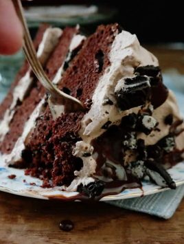Mississippi Mudslide Cake-from the Grandbaby Cakes cookbook, 3 layers of rich cake sandwich a Kahlua infused chocolate whipped cream, crushed cookies and chocolate ganache, this is a chocolate lovers dream cake!
