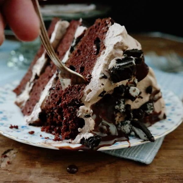 Mississippi Mudslide Cake-from the Grandbaby Cakes cookbook, 3 layers of rich cake sandwich a Kahlua infused chocolate whipped cream, crushed cookies and chocolate ganache, this is a chocolate lovers dream cake!