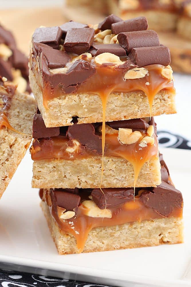These chocolate caramel bars are chewy and have layer upon layer of caramel and chocolate goodness on top of a soft oatmeal cookie crust.