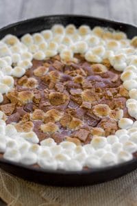 S'mores Skillet Cookie - A brown sugar cookie filled to the brim with chopped Hershey bars, marshmallows and graham crackers.