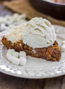 S'mores Skillet Cookie - A brown sugar cookie filled to the brim with chopped Hershey bars, marshmallows and graham crackers.