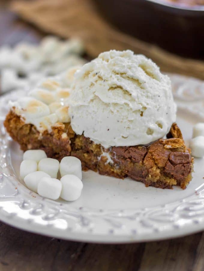 S'mores Skillet Cookie - A brown sugar cookie filled to the brim with chopped Hershey bars, marshmallows and graham crackers.