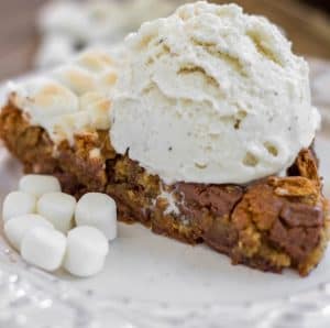 S'mores Skillet Cookie - A brown sugar cookie filled to the brim with chopped Hershey bars, marshmallows and graham crackers.