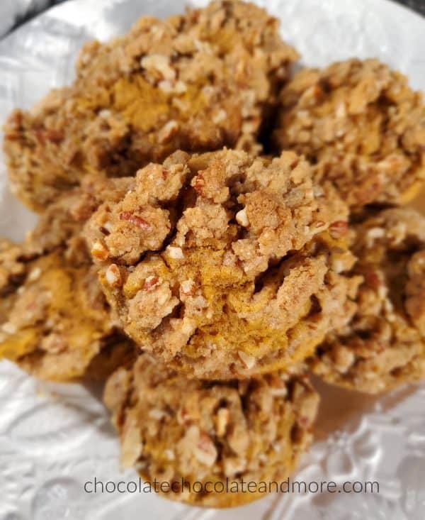  a plate full of sweet potato praline muffins stacked up