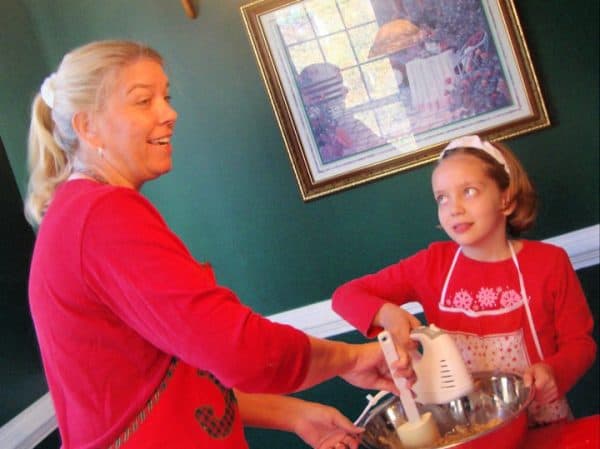 Joan Hayes and Grace Hayes mixing something in a bowl.