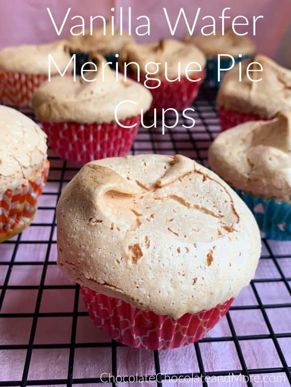 Vanilla Wafer meringue Pie Cups sitting on a metal cooling rack with a pink background.