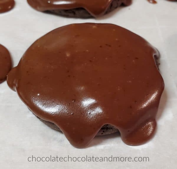 a chocolate cookie dripping with chocolate frosting