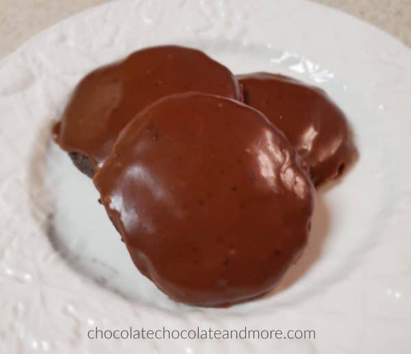 three chocolate iced cookies