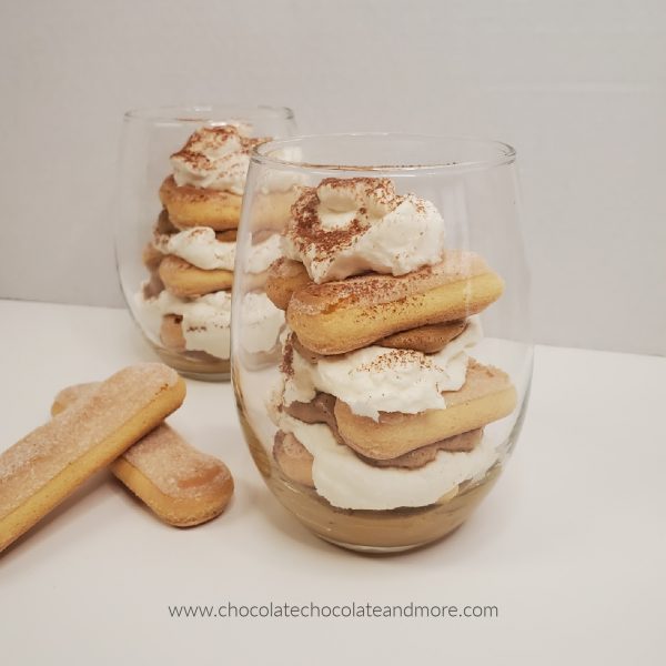 Whipped Coffee Tiramisu Parfait two clear glasses with layers of tiramisu and lady finger cookies