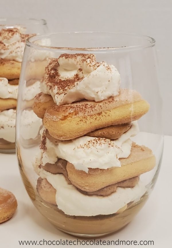 Whipped Coffee Tiramisu Parfait a clear glass filled with whipped coffee and tiramisu