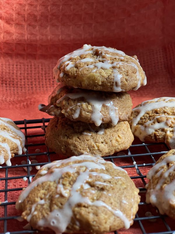 Pumpkin Spice Oatmeal Cookies 3 Pumpkin Spice Oatmeal Cookies stacked on a cooling rack.
