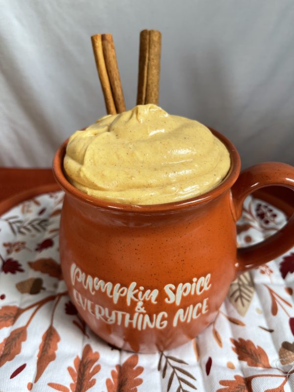 Pumpkin Spice Cheesecake Dip in an orange mug.