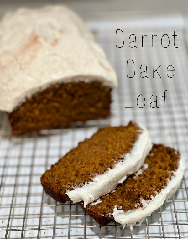 Carrot Cake Loaf Carrot Cake Loaf with 2 slices on a cooling rack