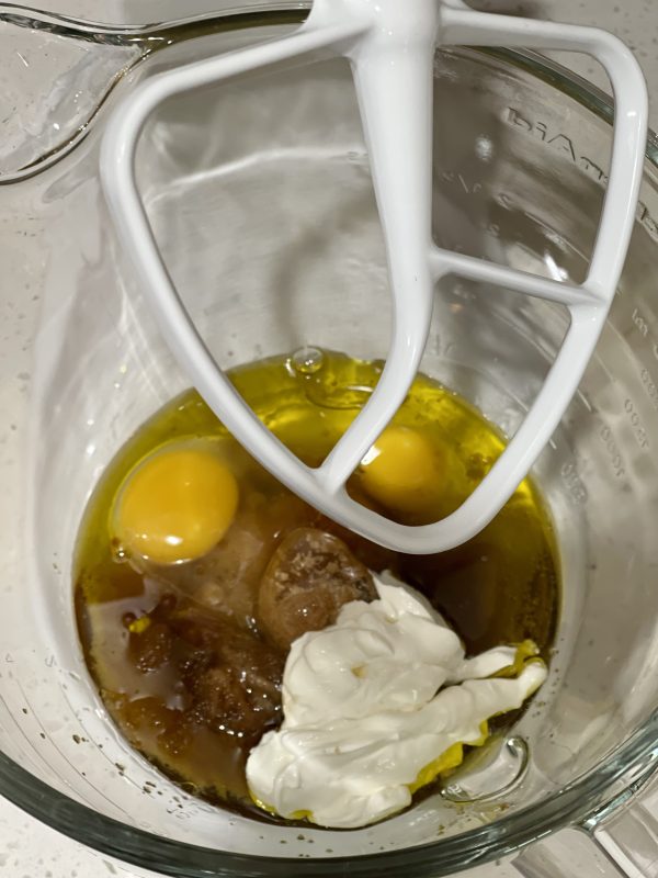 Carrot Cake Loaf Wet ingredients for Carrot Cake Loaf in a glass mixing bowl.