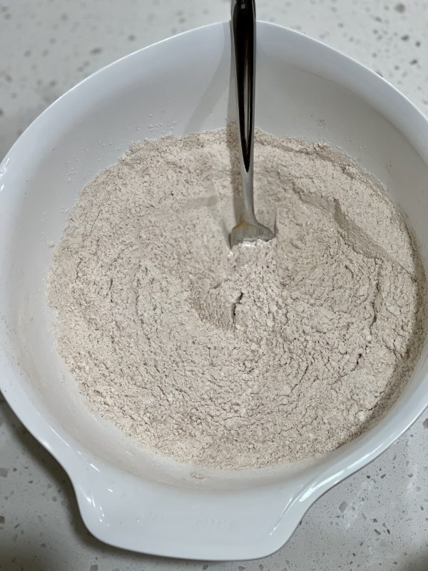 Carrot Cake Loaf Dry ingredients for Carrot Cake Loaf in a separate bowl.