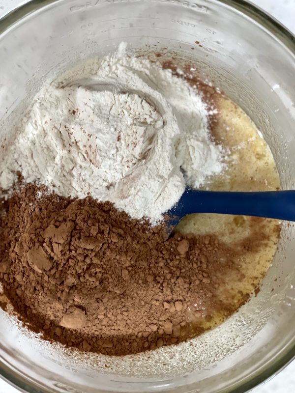 Add in cocoa powder and flour into the mixture