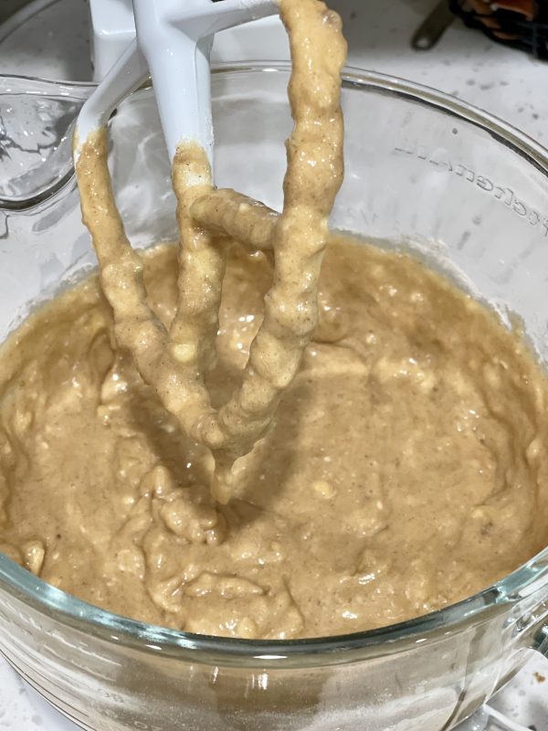 dry ingredients added to wet ingredients and bananas