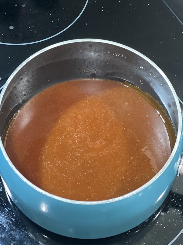 Silky Smooth Salted Caramel Sauce in a saucepan
