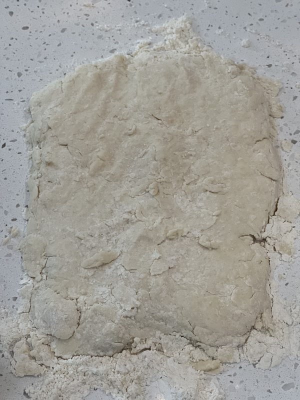 Chocolate Gravy Covered Buttermilk Biscuits dough shaped into a rectangle