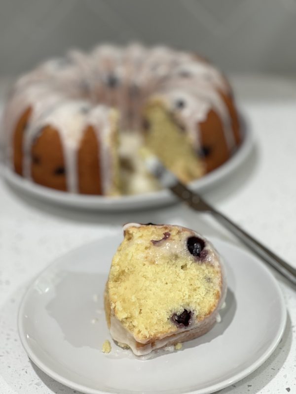 a slice of Lemon Blueberry Pound Cake on a plate 