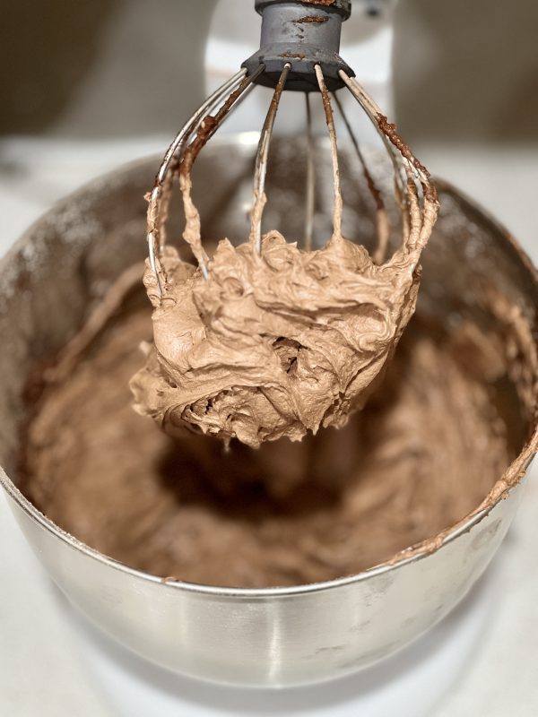 chocolate butter cream frosting after being whipped in stand mixer 