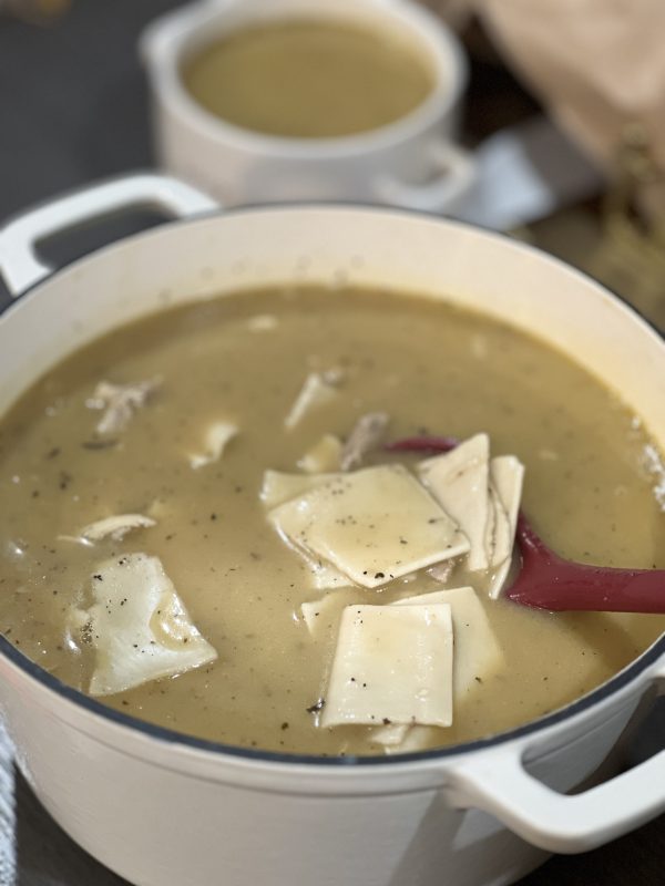 Leftover Turkey Dumplings in a white dutch oven