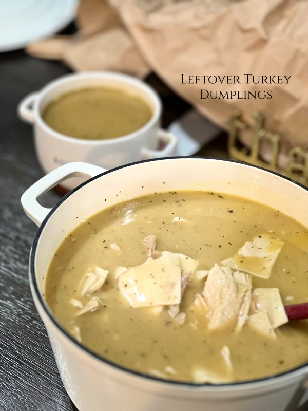Leftover Turkey Dumplings in a white dutch oven 
