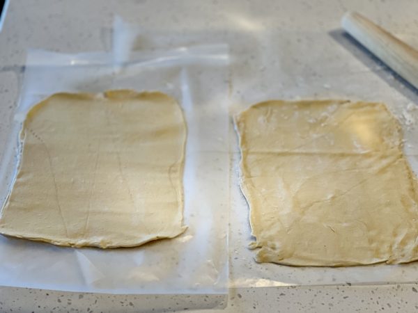 Tear & Share Crescent Christmas Tree dough rolled out on parchment paper