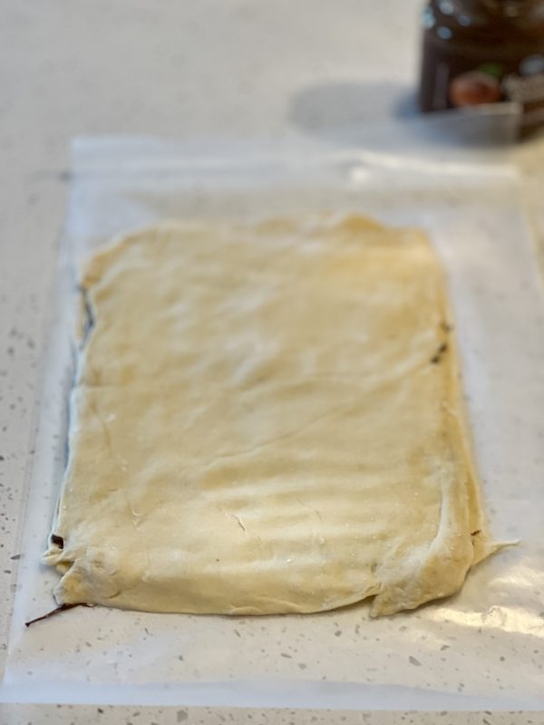 Tear & Share Crescent Christmas Tree dough with the nutella and the other to placed on top