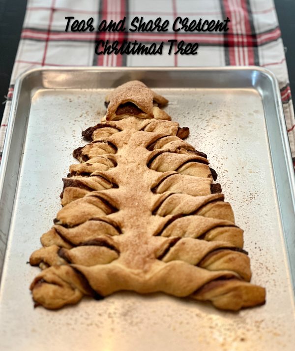 Tear & Share Crescent Christmas Tree on a cookie sheet on top of a plaid table runner