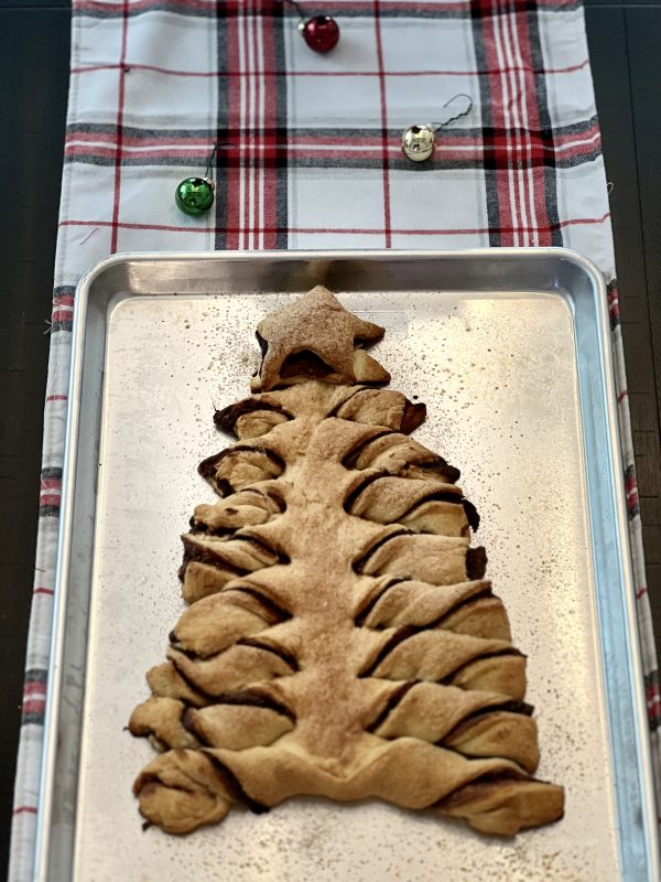 Tear & Share Crescent Christmas Tree on a cookie sheet on top of a plaid table runner