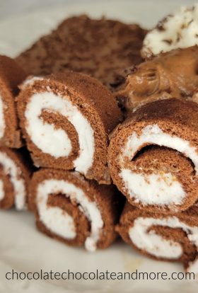 sliced chocolate swiss rolls outline a chocolate mousse cake