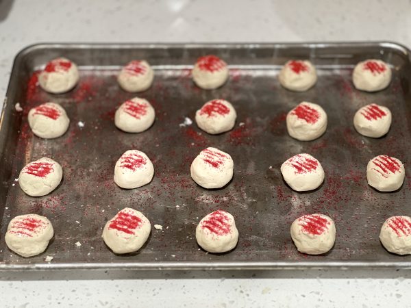 Classic Shortbread Cookies dough rolled into balls on a cookie sheet with sprinkles on top