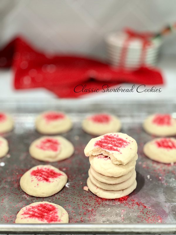 Classic Shortbread Cookies in a stack on a cookie sheet