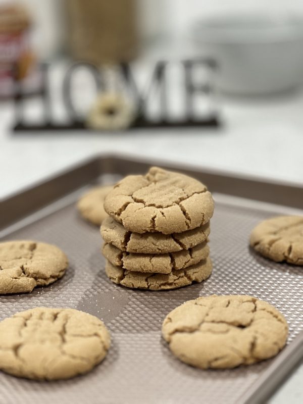 cookie butter cookies on a cookie sheet and stacked 4 high