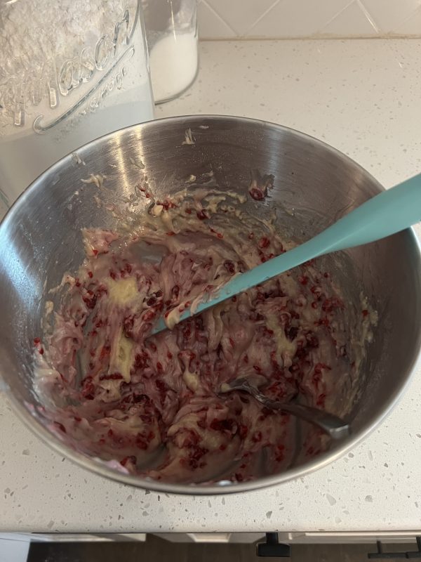 Raspberry Muffins batter in metal mixing bowl